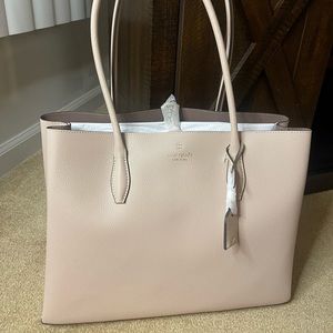New Kate Spade large Tote . Tags attached. Warm beige in color. Beautiful !!!